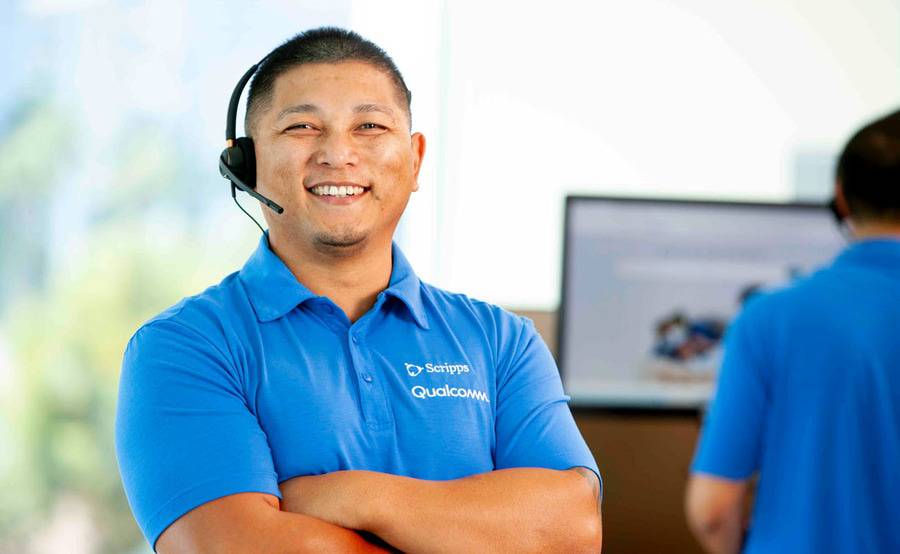 Concierge team member Jen Juico smiles for a pictures at the home office.