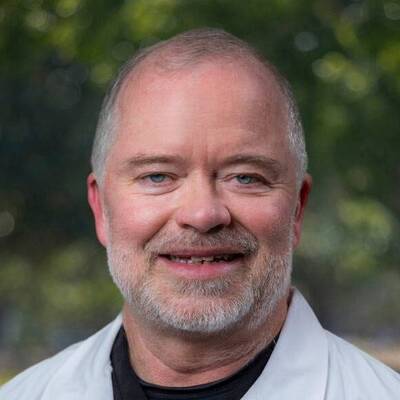 A headshot of Erik Hogen, MD